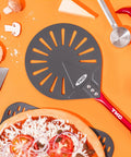 TKC 9-inch perforated pizza peel with red handle; aluminum turning spatula, top-down view