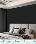 12 Pack Large Acoustic Wall Panels Covering 92.8 Square Feet With Solid Peel And Stick Sound Absorbing Backing To Knock Down Echoes And Elevate Your Home Studios Offices Or Media Rooms In Black on bedroom wall behind bed.