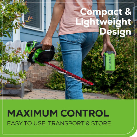 Person holding 40V Cordless Hedge Trimmer With 24-Inch Steel Blades 1-Inch Cutting Capacity 2Ah Battery And USB Charger Included.