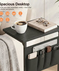 C Shaped End Table With Sliding Tray Under Sofa 28 Inch High Side Table With Storage Bag Black in living room setting
