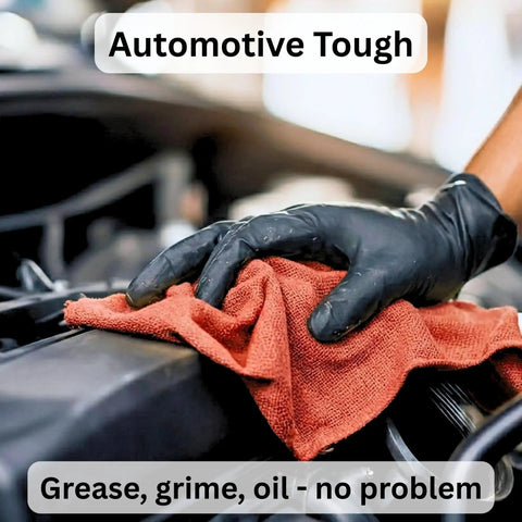 Mechanic using a Red Cotton Shop Towel for Garage and Auto Care, wiping engine in a car, showcasing absorbency and durability for oil spills.