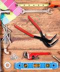 Assorted hand tools including a wrench, hammer, and Premium Steel Hand Seamer Set For Sheet Metal Bending And Flattening on a wooden surface.