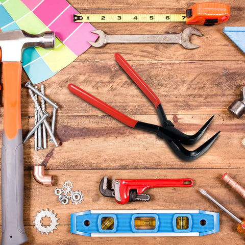 Assorted hand tools including a wrench, hammer, and Premium Steel Hand Seamer Set For Sheet Metal Bending And Flattening on a wooden surface.