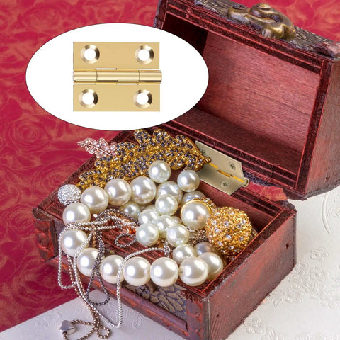 Open jewelry box with pearl necklaces and an Eight Piece One Inch Brass Hinges Set With Thirty Eight Gold Screws for small cabinets.