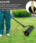 Person using Beefy Rolling Lawn Aerator With Fillable Drum And 18 Inch Tine Spikes, Heavy Duty Manual Push Garden Yard Tool.