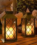 Solar Lanterns Outdoor Waterproof Garden Lanterns With Metal Leaf Pattern Dusk To Dawn Solar Powered Hanging Lights glowing on patio