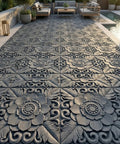 Installed Two Pack Antique Lotus Concrete Paver Molds for DIY Garden Path Stepping Stones in a modern patio setting.