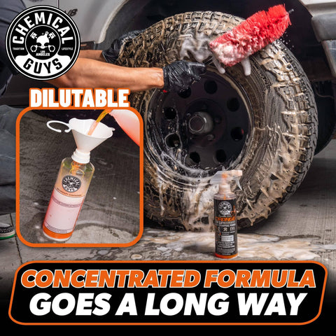 Orange Degreaser Spray For Engines And More Heavy Duty All Purpose Cleaner Pro Strength Breaks Down Grease Oil And Grime For A Deep Clean Of Engines Tires Undercarriages And Tools 16 Oz bottle near scrubbed tire, cleaning process visible.