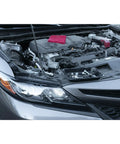 Open car hood showcasing engine with Big Magnetic Nut And Bolt Tray For Garages And Workshops 6x10 inches organizing small parts.