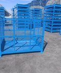 Heavy Duty Cold Rolled Steel Foldable Storage Cage Built Like A Tank Collapsible Industrial Bin for Warehouse Logistics, blue color, empty crate.