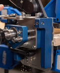 Close-up of MortiseMate Loose Tenon Jig in use with drill, showing auto indexing and mini work surface for woodworking joinery.