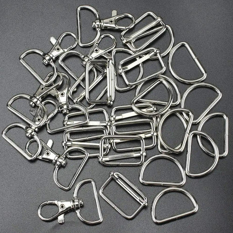 Top Shelf 60 Piece Bag Making Hardware Kit Featuring Swivel Snap Hooks D Rings Slide Buckles For Handbag Repairs Backpack Fasteners And Totally Sweet DIY Craft Builds In Polished Silver, assortment of silver snap hooks and D rings.