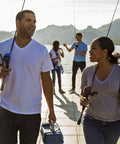 Two people fishing on a dock with Custom Spincast Reel And Rod Combo With 6 Foot Two Piece Fiberglass Rod EVA Handle