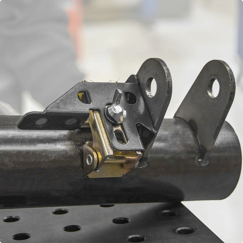 Adjustable magnetic tab holder, close-up on pipe for tack-welding