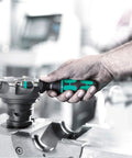 Hand using All-In-One Adjustable Torque Screwdriver Set 0.3-3.0 Nm with Rapidaptor Quick-Release Bit Holder on machinery.