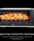Digital Air Fry Pro Countertop Oven With Extended Height And XL Capacity showcasing fries inside using Crisp Control Technology