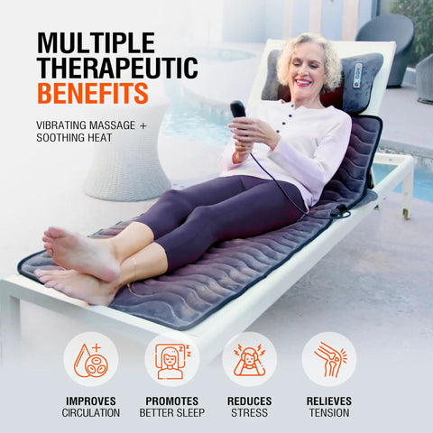 Woman using Full Body Massage Mat With Heat And Shiatsu Vibration for deep tissue relief on recliner