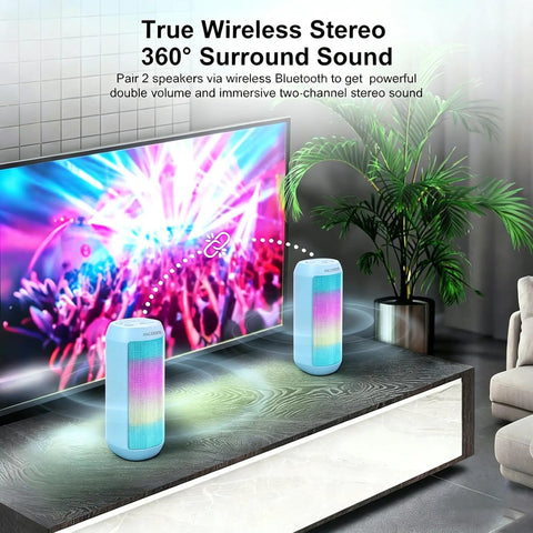 Powerful Portable Wireless Bluetooth Speaker With Stereo Sound LED Lights And Long 36 Hour Battery Life IPX4 Waterproof BT53 TWS Pairing Built In Mic Ideal For Outdoors Home Parties And Travel Powder Blue Gift on a table with glowing RGB lights.