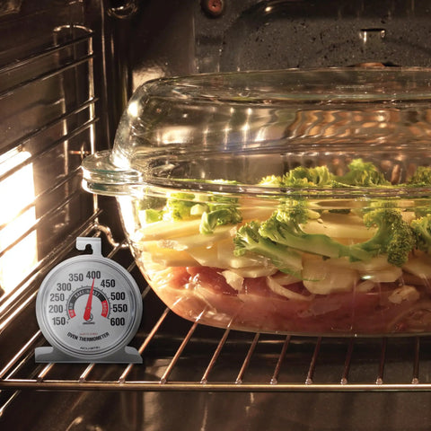 Stainless Steel Oven Thermometer 150 to 600 F Leave-In Safe for Oven and Grill next to a casserole dish in oven