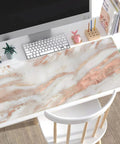 Rose Gold Marble Desk Pad For Mega Size 31.5 By 15.75 Inch Setup With Ultra Smooth Lycra Surface on a white desk