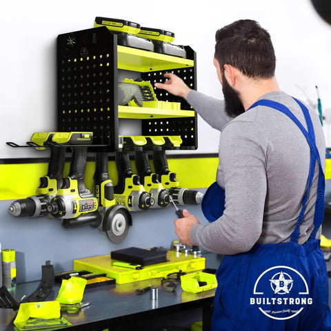 Man using Heavy Duty Power Tool Organizer Wall Mount Three Tier Steel Rack With Six Drill Slots Dual Pegboard Sides in garage.