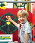 Child playing with 4 Piece Kids Outdoor Playset Accessories Featuring A Plastic Steering Wheel Telescoping Telescope And Safety Handles For Garden Backyard Treehouse And Playhouse Fun In Green Set 1