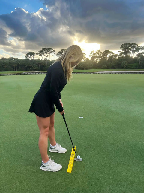 Golfer using T3 Golf Putting Training Aid For A Consistent Stroke Lower Your Score Pro Level Practice And Master Your Putting Fundamentals With Real World Feedback Built For Indoor And Outdoor Use Golden Yellow on green