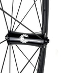 Close-up of 700C Road Bike Carbon Wheelset With 40mm UD X Weave Aero Rims And Rim Brake Surface hub and spokes