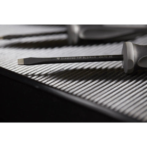 Close-up of Extreme Grip Diamond Tip 6 Piece Screwdriver Set With Diamond Coated Tips showing slotted tip detail on a textured surface.
