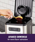 Person preparing 14 Cup Programmable Coffee Maker In Stainless Steel With 1 To 4 Cup Small Batch Setting And Grab A Cup Auto Pause.