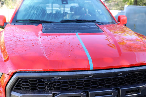 Red truck hood showing water beading with Touchless SiO2 Shield Sealant For Paint, Glass And Wheels, Water Activated, Spray On Rinse Off