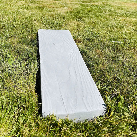 Wooden Board Molds For Concrete Stepping Stones And Garden Walkways, DIY Paver Molds For Patios And Paths, Reusable Plastic Molds Set Of 2 laying on grass.