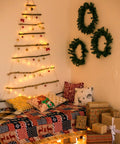 Cozy room with wall tree decorated using 24 Pack Battery Operated Fairy Lights On Silver Wire 7 Ft Long With 20 LEDs.