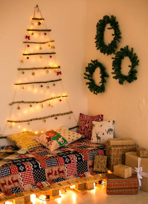 Cozy room with wall tree decorated using 24 Pack Battery Operated Fairy Lights On Silver Wire 7 Ft Long With 20 LEDs.