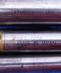 Close-up of three metal drill bits with inscriptions, showing part of a Three Piece Pro Grade Carbide Tipped Spiral Flute Drill Bit Set.