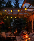 Outdoor Solar String Lights 33Ft With 15 Realistic Flickering Flame Bulbs illuminating a cozy patio at night