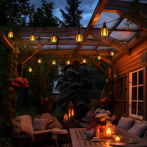 Outdoor Solar String Lights 33Ft With 15 Realistic Flickering Flame Bulbs illuminating a cozy patio at night