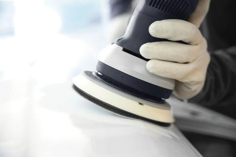 Close-up of Multi-Jetstream Dust-Free Random Orbital Finish Sander in use on a smooth surface for wood finishing.