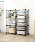 17 Cube Wire Closet Organizer Storage Shelves, black metal frame, six cubed shelves holding books, plants, and folded clothes.
