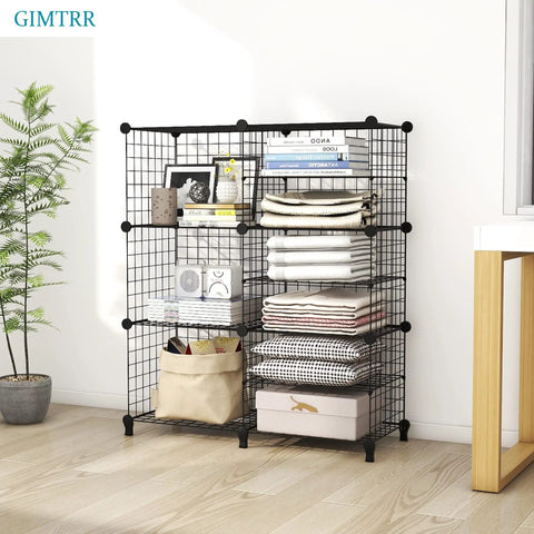 17 Cube Wire Closet Organizer Storage Shelves, black metal frame, six cubed shelves holding books, plants, and folded clothes.