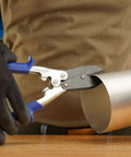 Using 5-Blade Crimper For Straight And Wide Cut Pinch-Thru Point Cutter on metal pipe, showcasing the hardened steel blades in action.