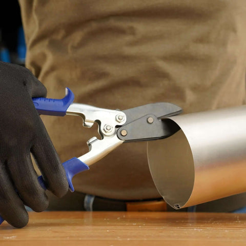 Using 5-Blade Crimper For Straight And Wide Cut Pinch-Thru Point Cutter on metal pipe, showcasing the hardened steel blades in action.