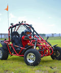 Red go kart with 169cc 10 HP engine, 35 MPH top speed, adult size, independent suspension, and Baja lights on grass field.