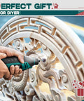 Neu Master 180W rotary tool kit; teal-black corded handheld drill used on a wooden relief sculpture