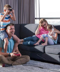 Family playing video games on couch using 32 Foot USB 3.0 Active Extension Cable with 5V 2A Power Adapter and signal booster chips