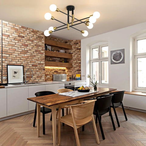 Starburst Inspired Eight Light Pendant Chandelier in Black Finish hangs in a modern kitchen with white and brick accents.