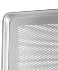 Close-up of the corner of a perforated aluminum sheet pan, showcasing reinforced edge and perforations for airflow.