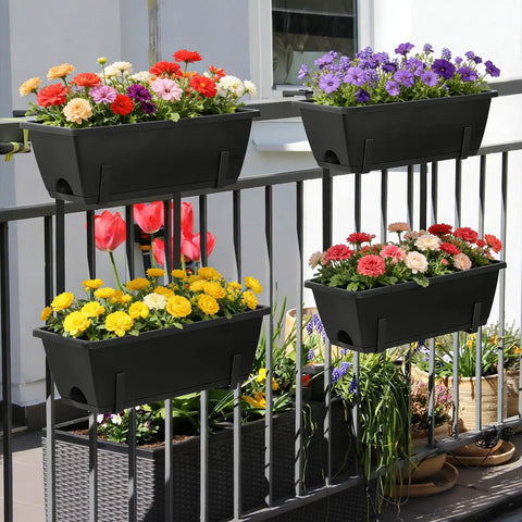 Black window boxes with colorful flowers on a balcony railing, part of the Level Up Your Porch Decor With This Ace Two Tier Railing Planter Box Set.