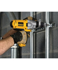 Person using Corded Hammer Drill Kit With Half Inch Capacity And Ten Amp Power For Masonry Wood And Steel Drilling Dual Mode Hammer And Drill Built For Pros And Serious DIYers Who Need Beefy Power on metal surface