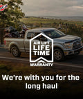 Truck with motorcycles on a highway, showcasing Heavy Duty Air Spring Kit For Ram 1500 2019 Through 2024 with lifetime warranty.